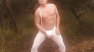 Outside in nature, bulging in a sexy Tendenze bodysuit - gayxo.com